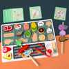 A wooden BBQ playset featuring various food items and matching game cards for children.