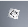 A square metal drain plug with a circular grid of openings for clearing clogs.