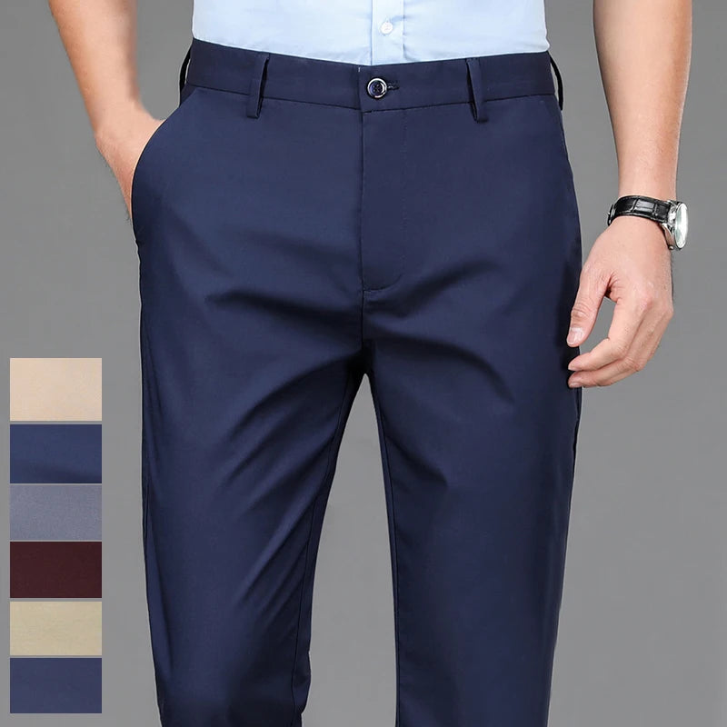 Navy blue men's stretch straight-leg trousers with a light blue shirt and a wrist watch