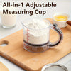 A clear measuring cup is shown filled with white powder on a wooden cutting board.