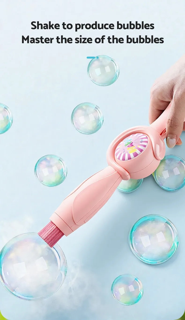 A hand is using a pink smoke bubble wand to produce and control the size of iridescent bubbles.