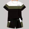 A black and olive green colorblock short sleeve t-shirt and matching shorts set displayed on a hanger.