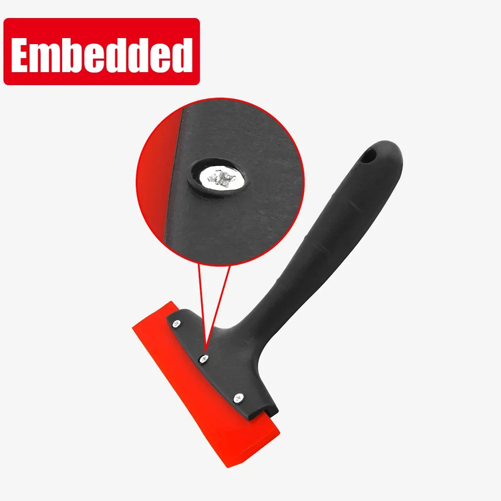 A black tile gap filling and cleaning scraper tool with a red handle and circular cleaning disc.