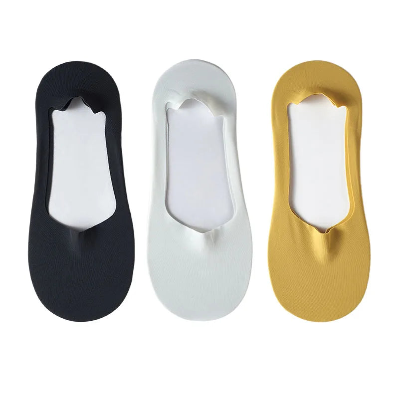 Three pairs of men's no-show socks with silicone grip in black, white, and gold.