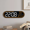 A large digital wall clock displaying the time 22:08, temperature 23°C, and the day of the week.