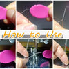 Demonstration of how to use a needle threader set for sewing and embroidery, showing the process of threading a needle.