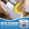 Hands are cleaning white sneakers with a yellow sponge and cream for easy shoe maintenance.