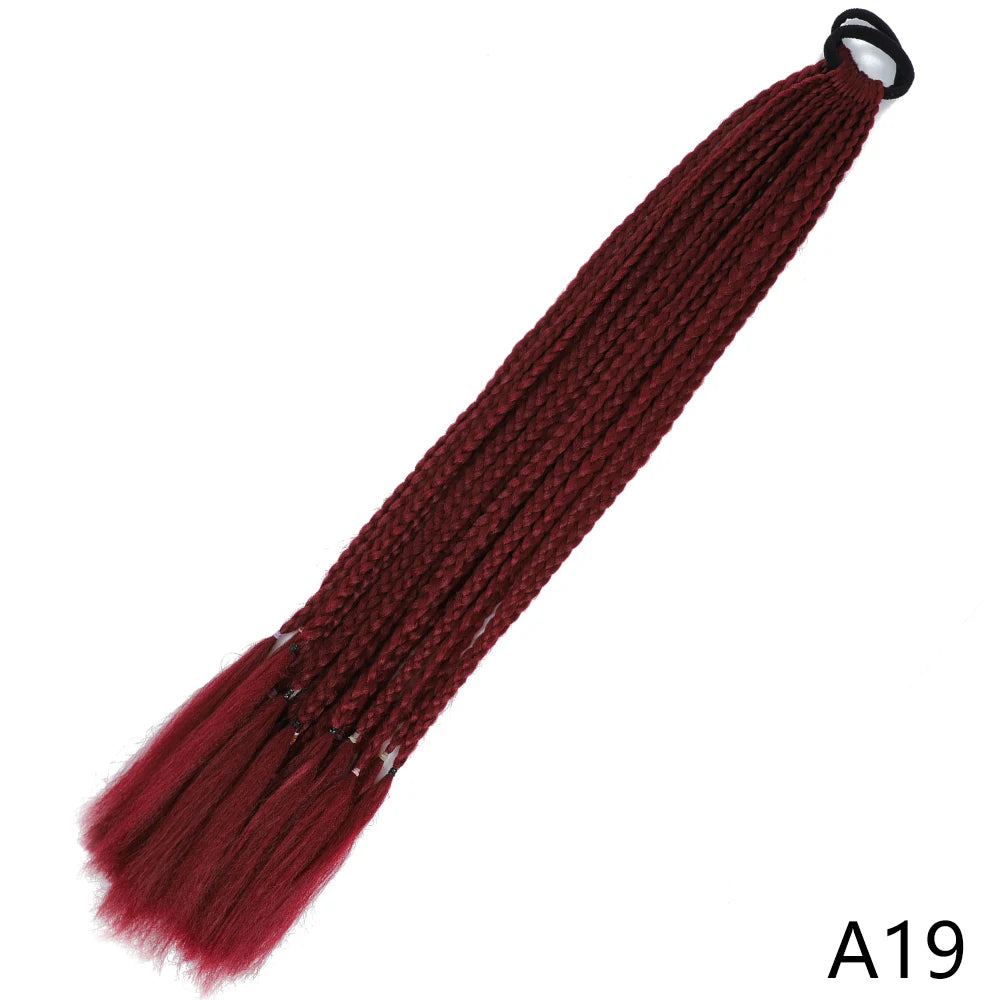 A gradient red pre-braided ponytail extension with an elastic band.