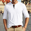 A man wearing a white long-sleeve shirt with a collar and chest pocket, paired with tan pants.